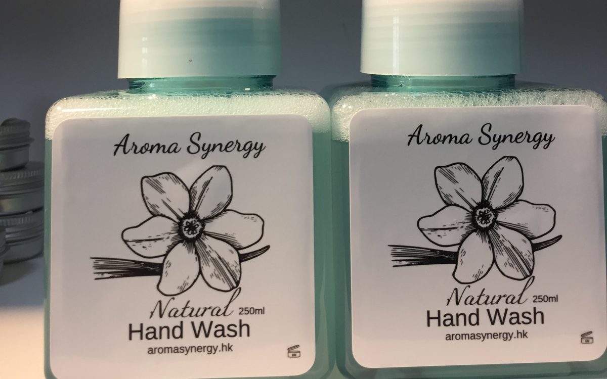 Two bottles of Aroma Synergy Natural Hand Wash 250 ml with a botanical label